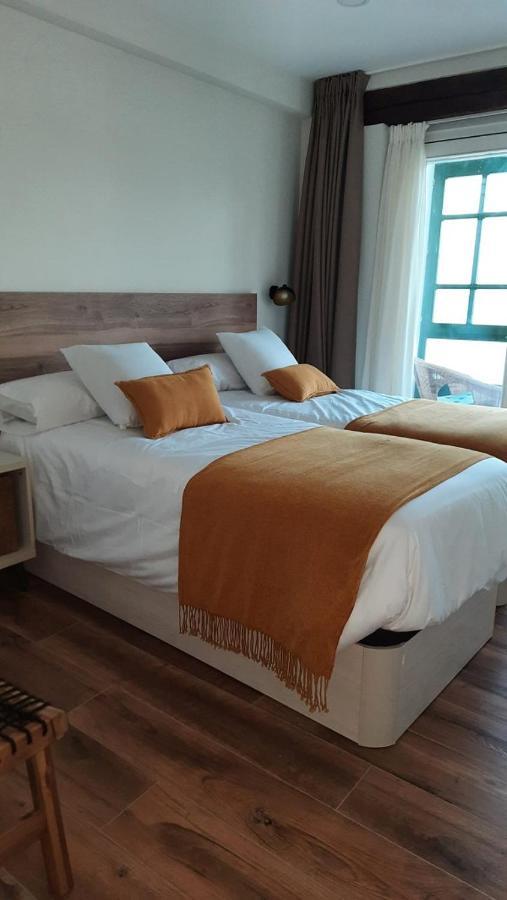 Apartamentos El Muelle 코밀라스 외부 사진