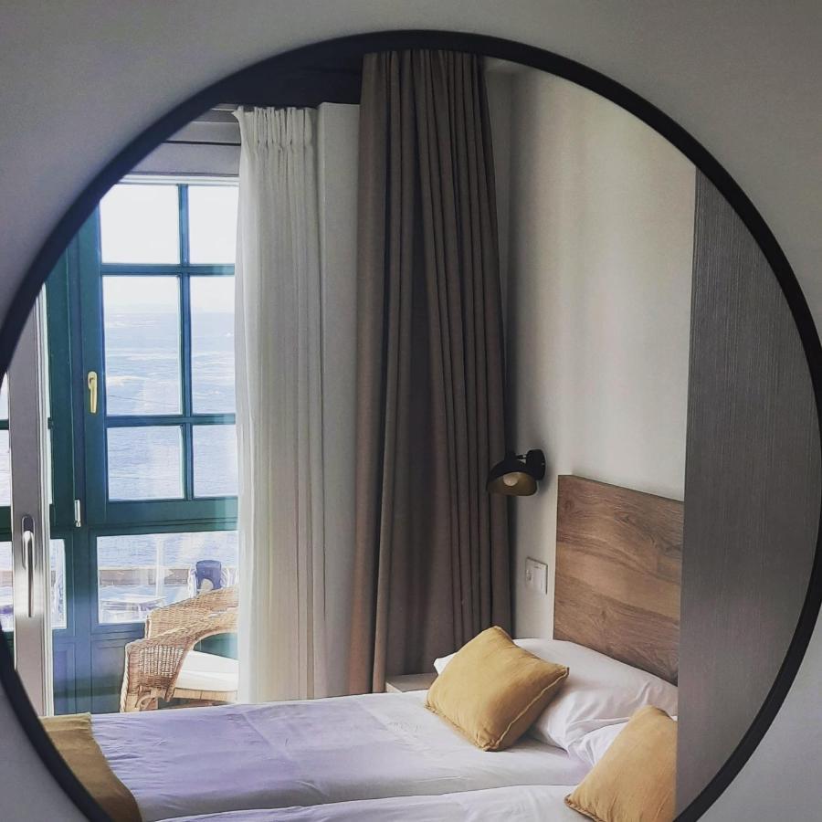 Apartamentos El Muelle 코밀라스 외부 사진